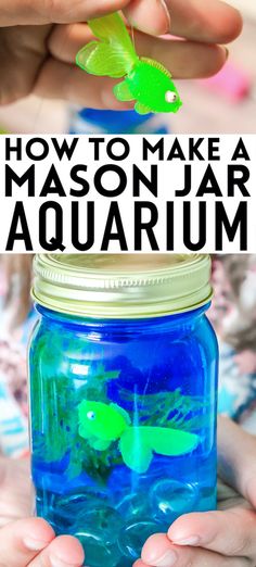 two hands holding a mason jar filled with blue liquid and green plastic fish