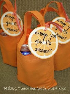 three orange bags with writing on them sitting next to each other