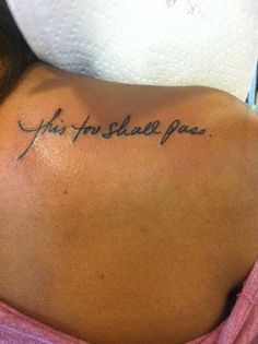 the back of a woman's neck with an inscription on it that reads, you are