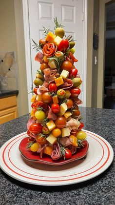 a christmas tree made out of fruits and vegetables