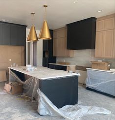 an empty kitchen is being remodeled with new cabinets and counter tops in the process of remodeling