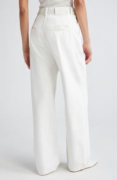 These sweeping wide-leg jeans are rendered in a sophisticated trouser-like silhouette crafted from organic Italian cotton kissed with stretch. 30 1/2" inseam, 21" leg opening; 15 1/2" front rise; 17" back rise (size 27) Zip fly with button closure Front slant pockets; back welt pockets 97% organic cotton, 2% elastomultiester, 1% elastane Machine wash, dry flat Made in Italy SPACE: A shop for emerging and advanced designers This brand has B Corp certification, representing business practices with Loulou Studio, Silhouette Crafts, Welt Pockets, Wide Leg Jeans, Leg Jeans, Wide Leg, Organic Cotton, Nordstrom, Trousers