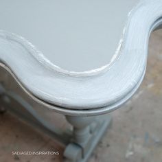 a close up of a white painted table