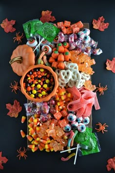 halloween candy and candies on a black surface