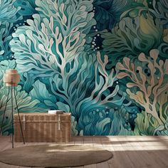 an ocean themed wallpaper with blue and green corals on the walls, next to a wicker basket