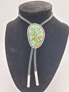 Kingman gem grade Turquoise Bolo Tie. This turquoise is from The Julian Collection. High grade stone, set in sterling. Simple and timeless, this will certainly make a statement. Absolutely stunner stone in this bolo. Well worth the price! All of the turquoise chosen for my bolo ties is absolutely some of the best old stock that can be found. Always priced fairly to ensure value, these are heirloom caliber. Adjustable Turquoise Ring With Stones, Adjustable Turquoise Ring With Gemstones, Artisan Turquoise Jewelry For Formal Occasions, Collectible Turquoise Jewelry With Large Stone, Western Style Turquoise Gemstone Jewelry, Adjustable Turquoise Jewelry With Stone Setting, Artisan Adjustable Turquoise Gemstone Necklace, Elegant Adjustable Turquoise Gemstone Necklace, Southwestern Adjustable Jewelry With Stones