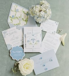 the wedding stationery is laid out on the table