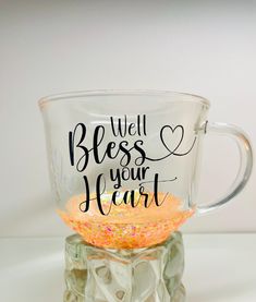 a glass cup with the words, well be your heart written in black on it