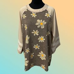 This Top By Easel Clothing Of Los Angeles Brings Playful Charm To Your Wardrobe. The Top Features A Mineral-Washed Daisy Flower Print On Both The Front And Back. The ¾ Length Raglan Sleeves Are Accented With Contrasting Stripes. The Official Color Name For This Comfortable And Stylish Piece Is Ash, Making It A Versatile Addition To Your Casual Collection. Product Details: Condition: New With Tags Color: Ash Material: 65% Cotton, 35% Polyester Self Design: Mineral-Washed Daisy Flower Print On Fro Ash Color, Sleeve Detail, Daisy Flower, Flower Print, Flower Prints, Womens Clothing Tops, Knit Top, Ash, Daisy