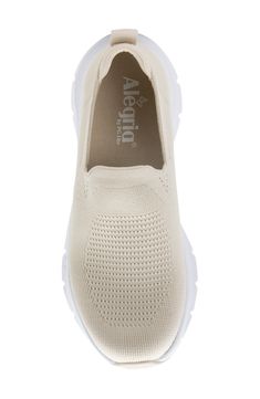 Signature cushioning with exceptional arch support ensures all-day comfort in this sporty slip-on featuring a stylish knit design. Removable, cushioned insole with arch support Textile upper and lining/rubber sole Imported American Podiatric Medical Association (APMA) Seal of Acceptance Comfortable Sports Slip-ons With Arch Support, Comfortable Beige Slip-ons With Ortholite Insole, Comfortable Beige Slip-ons With Cushioned Footbed, Comfortable Slip-on Sneakers With Arch Support, Comfortable Beige Slip-on Sneakers With Textured Sole, Comfortable Beige Textile Slip-on Sneakers, Beige Round Toe Slip-on Sneakers For Sports, Slip-on Sneakers For Light Exercise With Arch Support, Comfortable Textile Walking Shoes With Arch Support