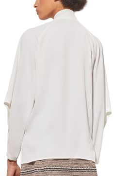 Raglan long sleeves underscore the contemporary style of a tie-neck top that's ideal for the office and beyond. 26" length (size XS) Split neck with ties Long sleeves with button cuffs 100% polyester Machine wash, dry flat Imported White 3/4 Sleeve Office Tops, White 3/4 Sleeve Tops For Office, White 3/4 Sleeve Blouse For Work, Silk Long Sleeve Blouse For Layering, White Tie Sleeve Blouse For Fall, White Tie Sleeves Blouse For Fall, White Tie Sleeves Top For Daywear, White Blouse With Tie Sleeves For Fall, White Tops With Tie Sleeves For Daywear