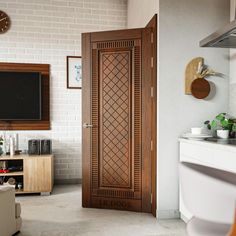 a living room with a tv on the wall and a wooden door in front of it