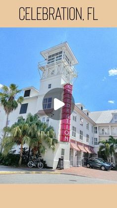 an image of a hotel sign with cars parked in front and palm trees around it