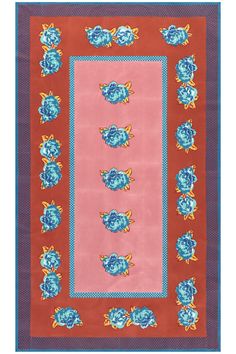 a red rug with blue flowers on it and an orange border in the middle,