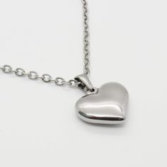 "Silver Stainless Steel Heart Pendant Necklace, Men's Necklace, Dimensional Heart Pendant, Men's Jewelry, Romantic Jewelry, Woman's Necklace, 3/4\" x 13/16\" x 3/16\" thick STAINLESS STEEL CHAINS - Are a more affordable alternative to sterling chains. They are durable, hypo allergenic and resist tarnishing. STAINLESS STEEL CHAINS - Hypo Allergenic, Resist Tarnishing Flat Link Chain, 4 x 3mm, Stainless Steel Chain, Lobster Clasp Twist Curb Chain, 4.6 x 3.3 x 0.6mm, Stainless Steel Chain, Lobster Tie Choker, String Necklace, Double Heart Necklace, Face Necklace, Romantic Jewelry, Stainless Steel Chain Necklace, Brown Jewelry, Heart Locket Necklace, Romantic Jewellery