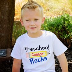 It's back to school time! Help your little one stroll into school with our Preschool Rocks Design Tee. Order options: Personalize with first name Select thread color for name Styles Girls short sleeve puff Girls short sleeve puff with ruffle bottom Unisex short sleeve Unisex raglan sleeve Girls puff tee sizes 12mo, 18mo, 2T, 3T, 4T, 5T, 6, 8, 10 Unisex tee sizes 12mo, 18mo, 2T, 3T, 4T, 5T, 6, 8 Raglan tee sizes 12mo, 18mo, 2T, 3T, 4T, 5T, 6, 8, 10 School Spirit Short Sleeve T-shirt, Short Sleeve T-shirt For School Spirit, Preppy Short Sleeve School T-shirt, Preppy Short Sleeve T-shirt For School, School Spirit Short Sleeve T-shirt For Back To School, Back To School Spirit Short Sleeve T-shirt, School Spirit Short Sleeve Tops, Back To School Spirit T-shirt With Short Sleeves, Back To School T-shirt With Name Print