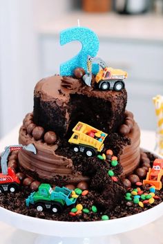 a birthday cake with cars and trucks on it