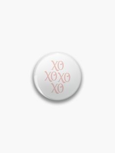 a button with the words exoxo xo in pink letters on white background