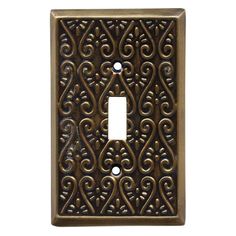 an antique light switch cover with intricate designs on the front and back sides, in bronze