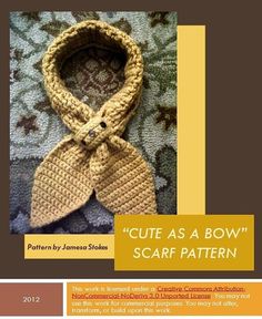 a knitted scarf with a bow on it