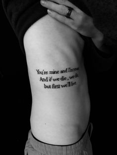 a woman's arm with a quote on it