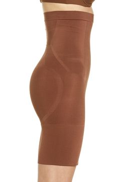 This sculpting shaper is lightweight and powerful, featuring fully-bonded front-panels for a flat stomach and edge-bonded side panels for squeeze-free slimming. Support level: sculpt Comfortable sculpting power with less bulk Lined double gusset Bonded tummy panel Side panels for squeeze-free slimming and easy movement Leg openings stay invisible under clothing Easy double-gusset opening 80% nylon, 20% spandex Machine wash, dry flat Imported Seamless Brown Shapewear, Fitted Seamless Brown Bottoms, Fitted Seamless Shapewear With Short Leg, Fitted Seamless Shapewear Shorts, Fitted Shapewear Shorts With Seamless Construction, Fitted Short Shapewear With Seamless Construction, Fitted Seamless Brown Shapewear, Fitted Brown Shapewear Bottoms, Fitted Seamless Shapewear Above Knee