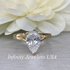 "This ring is a pear shape simulated diamond in a splint shank design made with solid 14k yellow gold item #5511 -Approximate total carat weight: 3.00ctw diamond equivalent -Center Stone Size: 12x8mm approx. 3.00ct diamond equivalent -Gem Type: simulated diamond -Stone Shape: Pear -Stone Clarity: VVS1 -Stone Color: D -Moh's Scale: 8.5 Hardness -Metal Type and Purity: 14k yellow gold -Setting: 3 prong split shank design -Stock Ring Size: 6 -Country of Manufacturing: USA (Michigan) For customizati Teardrop Diamond Ring With Vs Clarity For Anniversary, Anniversary Teardrop Diamond Ring With Vs Clarity, Teardrop Vvs Clarity Ring For Anniversary, Teardrop Vvs Clarity Ring For Promise, Teardrop Solitaire Jewelry For Anniversary, Pear-shaped Diamond Cut Jewelry For Wedding, Pear-shaped Center Stone Promise Ring, Vvs Clarity Teardrop Ring For Anniversary, Formal Teardrop Wedding Ring With Vvs Clarity