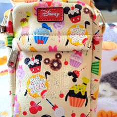 Disney Mickey Mouse And Minnie Mouse Sweet Treats Crossbody Bag. Super Nice With A Large Zipper Compartment And A Smaller Zipper Compartment On The Front. It Has An Adjustable Strap And Is Made Of A Soft Leather. Disney Style Shoulder Bag With Removable Pouch, Disney Multicolor Bags With Adjustable Strap, Disney Crossbody Bags For Disney Trips, Disney Style Crossbody Bags For Disney Trips, Cute Multicolor Bags For Disney Trips, Cute Minnie Mouse Multicolor Bags, Cute Multicolor Minnie Mouse Bag, Summer Sweet Treats, Holographic Purse