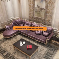 a purple couch sitting on top of a rug in a living room