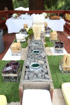 a long table is set up with plates and bowls