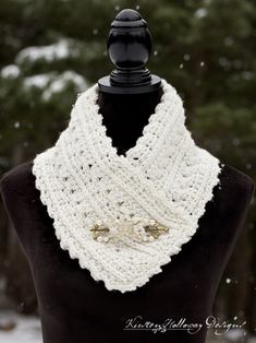 a white crocheted cowl on top of a mannequin