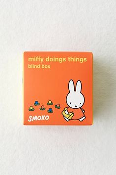 an orange box with the words miffy doing things behind it