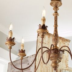 a chandelier with five lights hanging from it