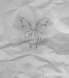 a paper with a butterfly drawn on it's back and the bottom part of its wings