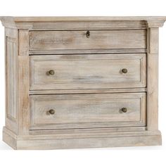 a white dresser with three drawers and two pulls on the bottom drawer, against a white background