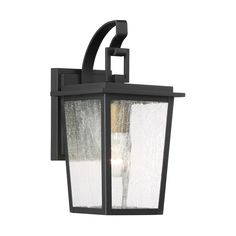 an outdoor wall light that is black and has frosted glass on the front side