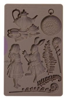 a cookie sheet with an image of rabbits and teapots