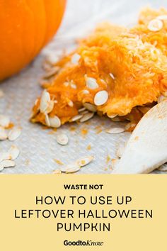 a wooden spoon sitting on top of a table next to a pile of pumpkins