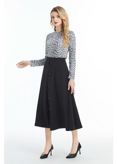 Our Black Midi Skirt with Front Button Detail is the perfect blend of sophistication and style. Crafted from high-quality denim fabric, this skirt is soft to the touch and comfortable to wear. It features a midi length, which falls below the knee, making it perfect for both casual and formal occasions. The skirt is designed with a button detail that runs down the front of the skirt, adding a touch of elegance and femininity to the overall design. The skirt also features a hidden back zipper clos Black Midi Skirt, Black Midi, Denim Fabric, Button Detail, Formal Occasion, Modern Woman, Midi Length, The Knee, Midi Skirt