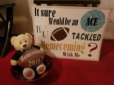 a teddy bear sitting next to a sign that says it sure would be an ace