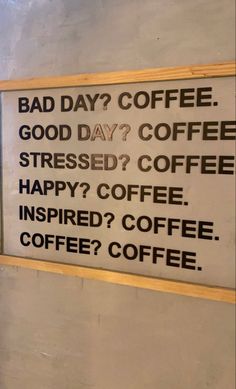 a sign that says bad day? coffee good day? coffee stressed? coffee happy? coffee inspired? coffee