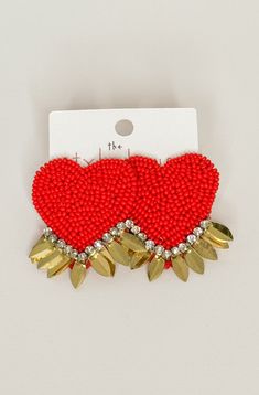 Make a statement with our Goldenheart Oversized Heart Earrings! These beaded heart earrings feature bold gold accents and sparkling rhinestones. Perfect for adding a touch of fun and glamour to any outfit. (Warning: may cause excessive compliments and envious stares.) Heart Shaped Beaded Earrings For Party, Gold Beaded Earrings For Valentine's Day Party, Valentine's Day Gold Beaded Earrings For Party, Trendy Heart Beaded Earrings For Valentine's Day, Gold Heart Beaded Earrings For Party, Gold Heart Shaped Beaded Earrings For Party, Trendy Party Heart Earrings With Heart Charm, Gold Heart-shaped Beaded Earrings For Party, Trendy Gold Heart Earrings With Beads