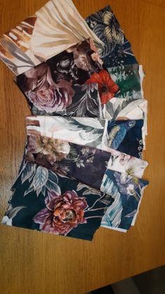 several pieces of cloth with flowers on them