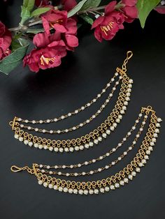 These matte gold finished AD/CZ support chains / ear chains with ruby and green stones and chains for traditional earrings gives a completely royal look! Product care: Avoid contact with Chemicals such as Perfumes or any Sprays. Prevent the Jewellery from the water. Use Butter Paper or Cotton Cloth to store your Jewellery for a longer Product life. Traditional Festive Jewelry With Beaded Chain, Traditional Gold Plated Earrings With Pearl Chain, Traditional Gold-plated Earrings With Pearl Chain, Traditional Beaded Chain Jewelry For Festivals, Traditional Beaded Chain Jewelry For Festive Occasions, Festive Beaded Dangle Chain Jewelry, Traditional Gold Earrings With Beaded Chain, Traditional Gold-plated Jewelry With Adjustable Chain, Festive Beaded Temple Jewelry