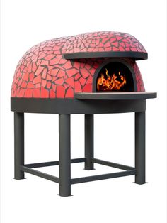 an outdoor pizza oven with red tiles on it's sides and flames coming out