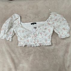 A Little Bit Of Eyelet And A Little Bit Of Ruffle In The Adorable Crop Top! Beautiful Floral Puff Sleeve Brand New With Tags $48 Retail White Floral Print Crop Top For Spring, White Feminine Floral Print Crop Top, White Floral Print Feminine Crop Top, Puff Sleeve, Pink White, Crop Top, Blush, Womens Tops, Crop Tops