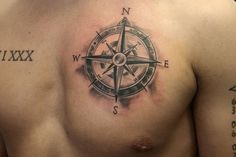 a man with a compass tattoo on his chest