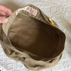 "Vintage Marine Corps Dress Uniform Kakey Tan Wool or Gaberdine Slip On Hat Cover. Berkshire Lee Uniform Cap Mfg. Co. This gaberdine hat cover is in great shape for its age. It has a Cleaners Tag on it. The Wool one has about 11 little holes around the top from a moth that got to it over it's storage time. Size: 6 7/8, 10 1/2\" From Side to Side, 4 1/2\" Tall Crown in Front, 21 3/4\" Around Crown, For other hats, jewelry and vintage items see: www.VeryVictorianStudio.etsy.com For sewing related Vintage Khaki Cap, Vintage Khaki Hat With Short Brim, Vintage Khaki Brimmed Hat, Vintage Brimmed Khaki Hat, Vintage Military Visor Hat, Vintage Beige Visor Hat, Vintage Marine Corps, Tall Crown, Marine Corps