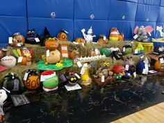 a table topped with hay bales covered in halloween decorations