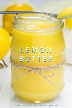 a jar filled with lemon butter sitting on top of a table